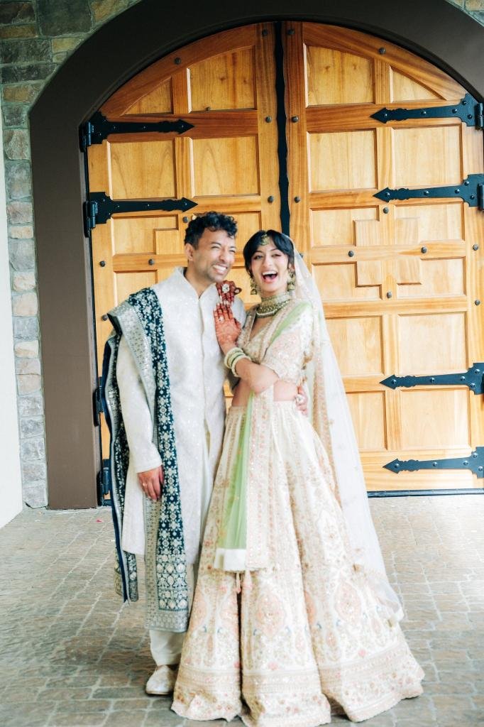 Bride and groom standing side by side for a wedding portrait