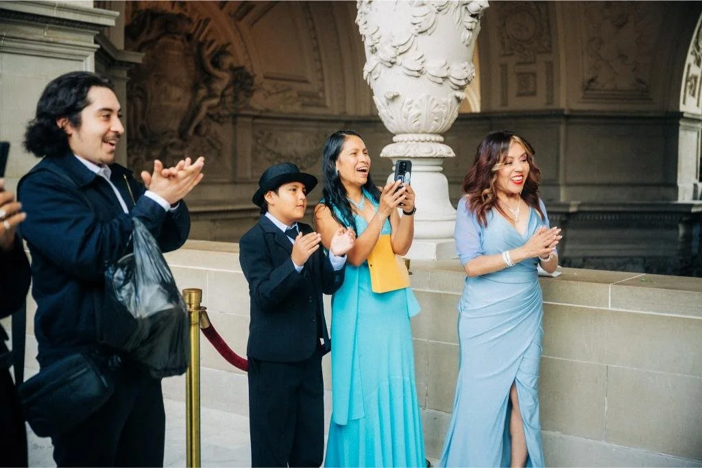 Guest clapping during the ceremony.