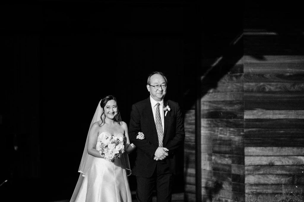 Bride walking down the aisle with her father at Stanly Ranch