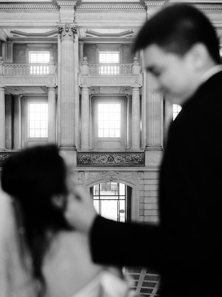 Bride and groom looking at each other during their San Francisco City Hall elopement
