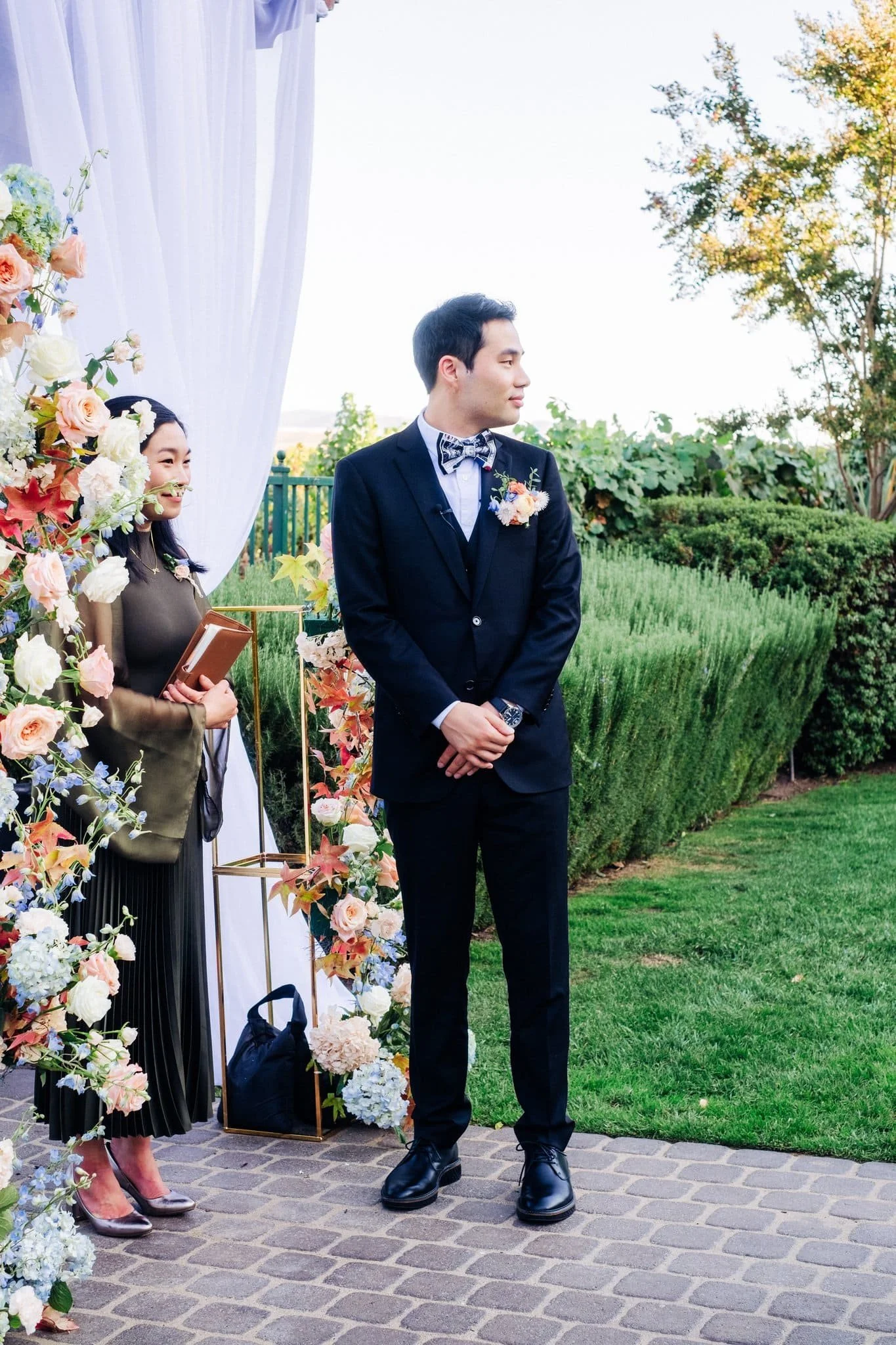 groom waiting at altar during ceremony palm event center pleasanton wedding