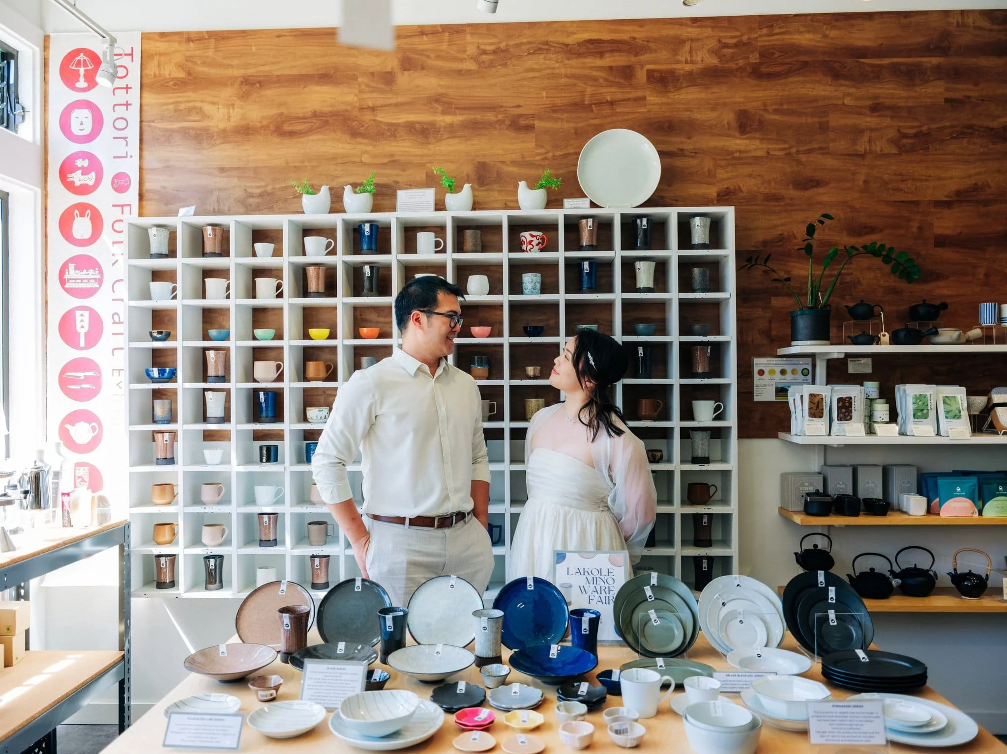 Bride and groom shopping for plates in San Francisco Japantown during their elopement day.