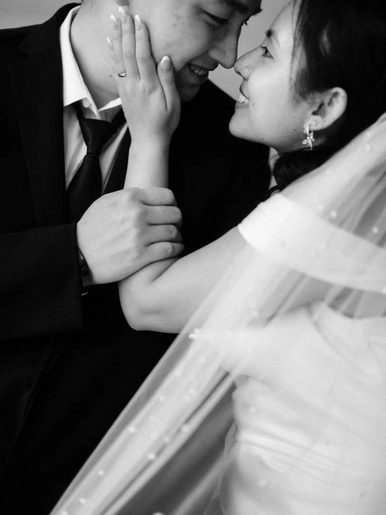 Bride and groom embracing after their City Hall ceremony with the bride's wedding ring visible