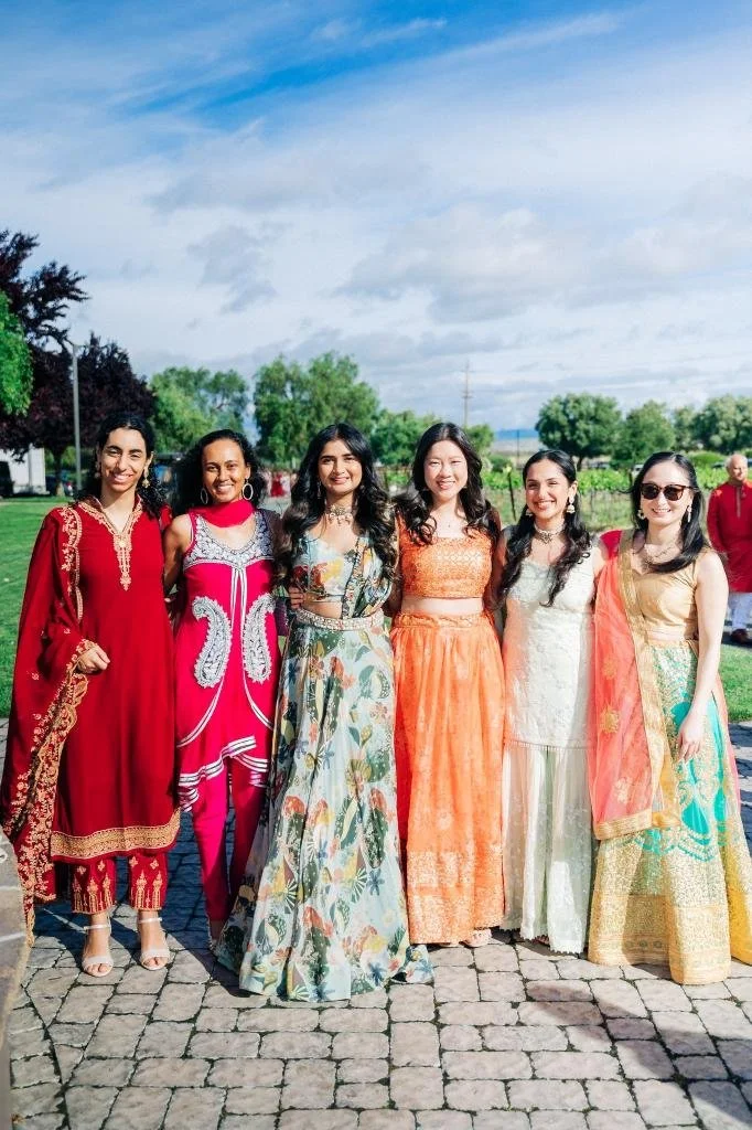 Wedding guests gathered in colorful attire before the ceremony