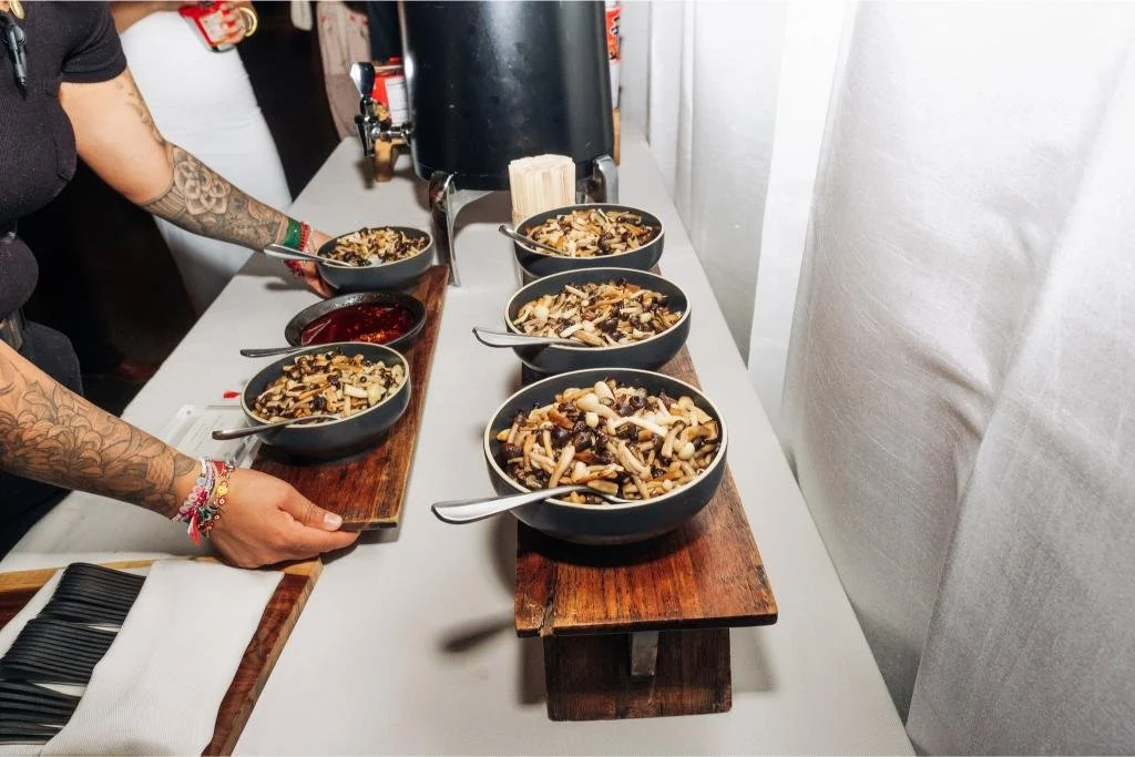 Mushroom dish being plated before dinner service at the wedding reception