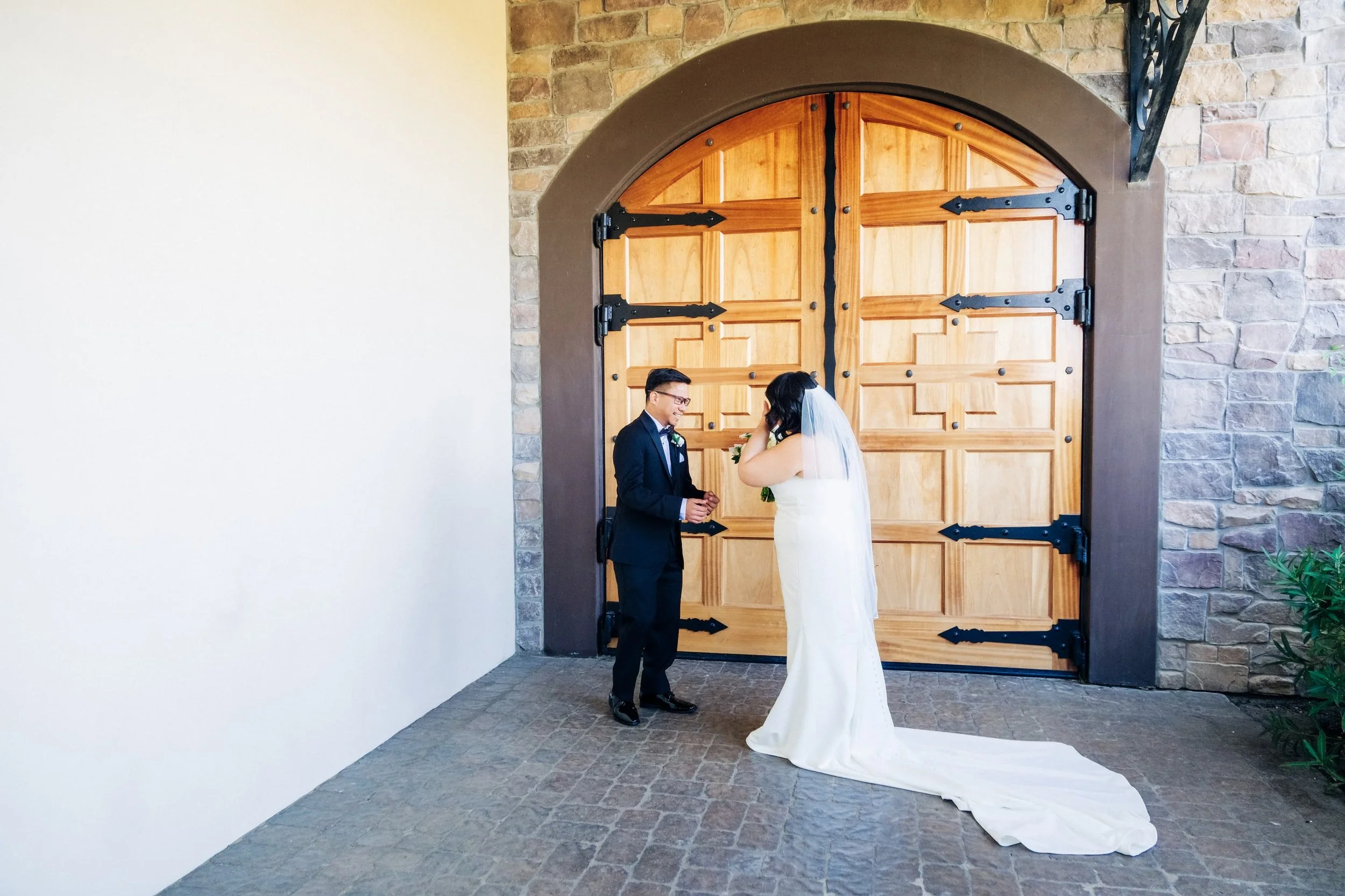 Bride and groom sharing first look at Palm Event Center wedding