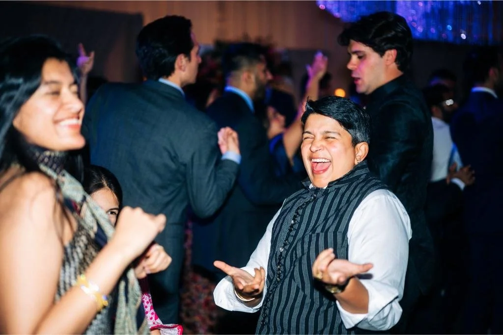 Wedding guests dancing together on the reception dance floor