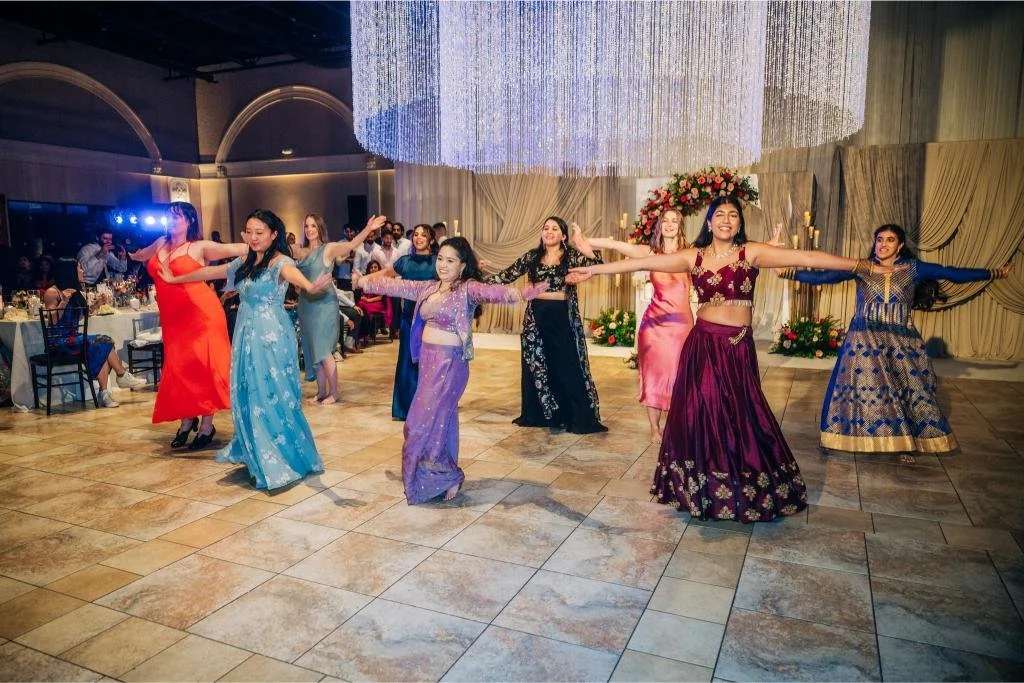 Wedding guests performing a choreographed dance during the reception