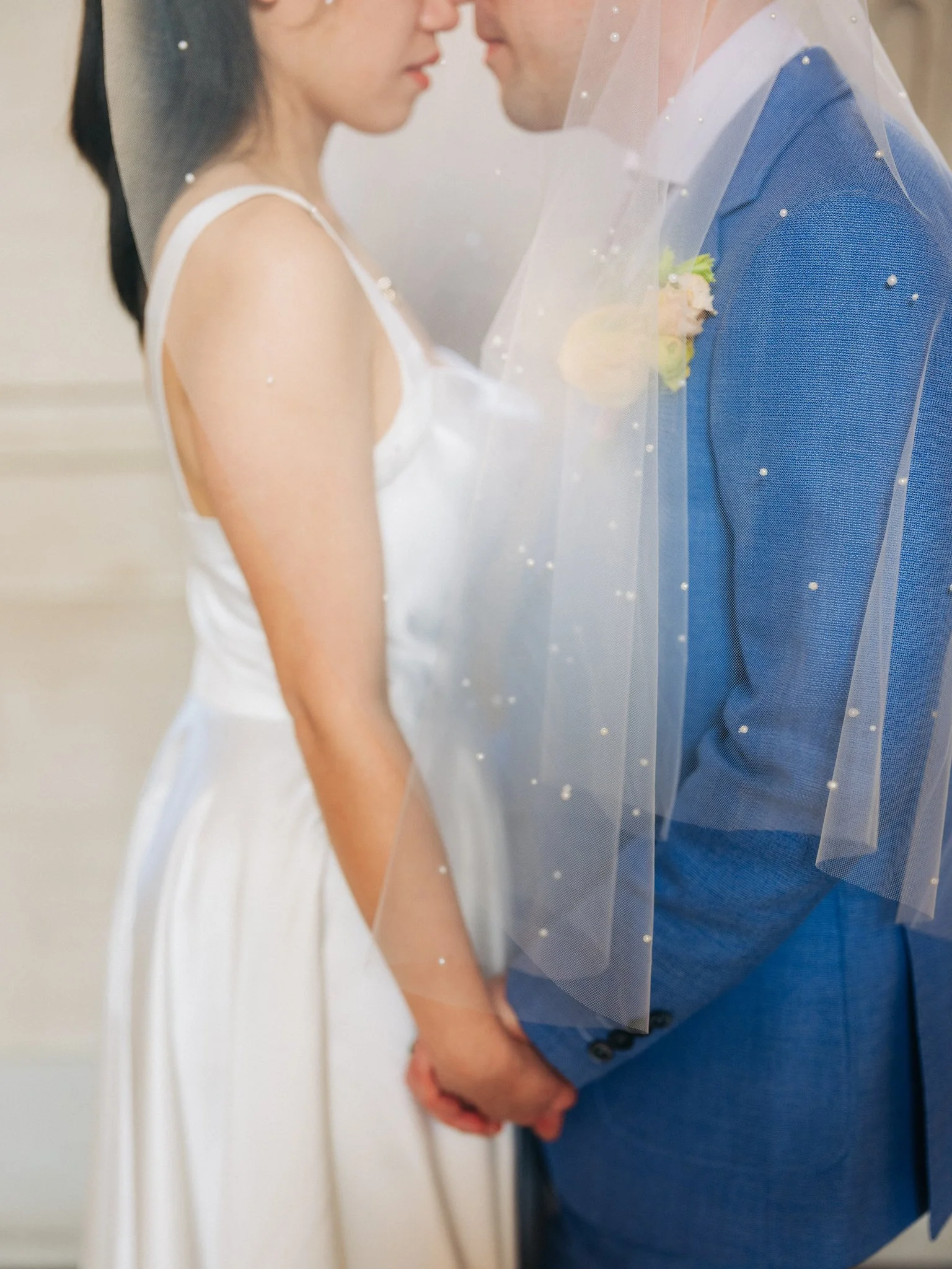 Bride and groom standing face to face during San Francisco City Hall wedding