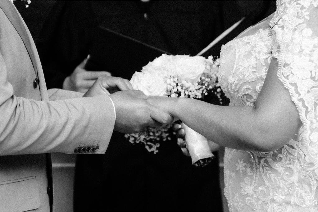 Close-up of the couple holding hands during the ceremony.