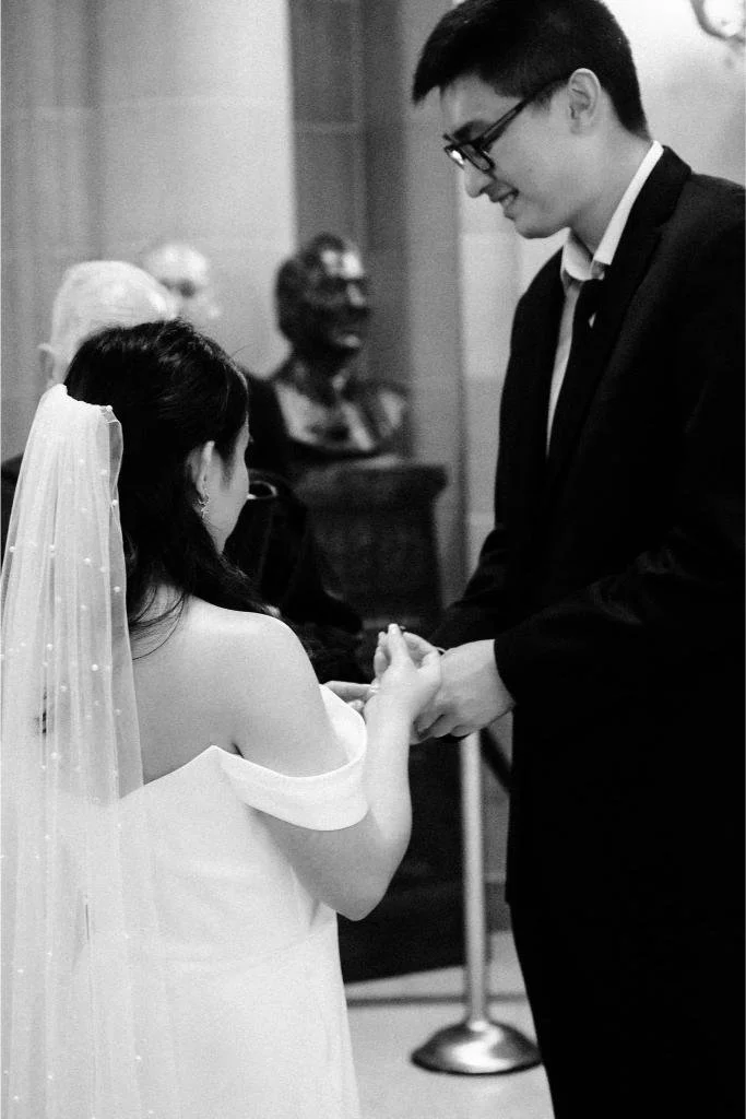 bride-placing-ring-groom-city-hall-ceremony.jpg