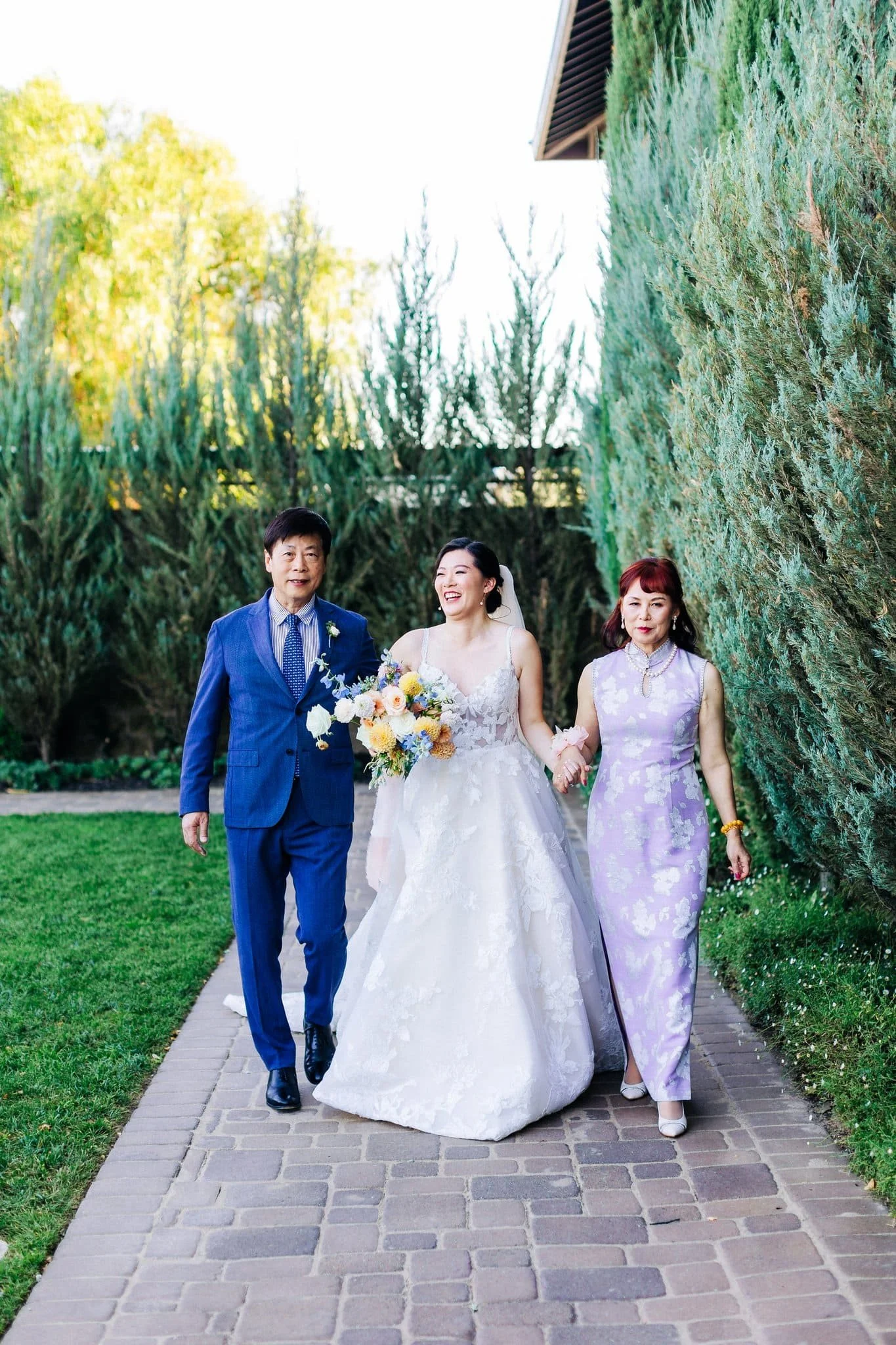 bride walking down aisle with parents wedding ceremony palm event center pleasanton ca