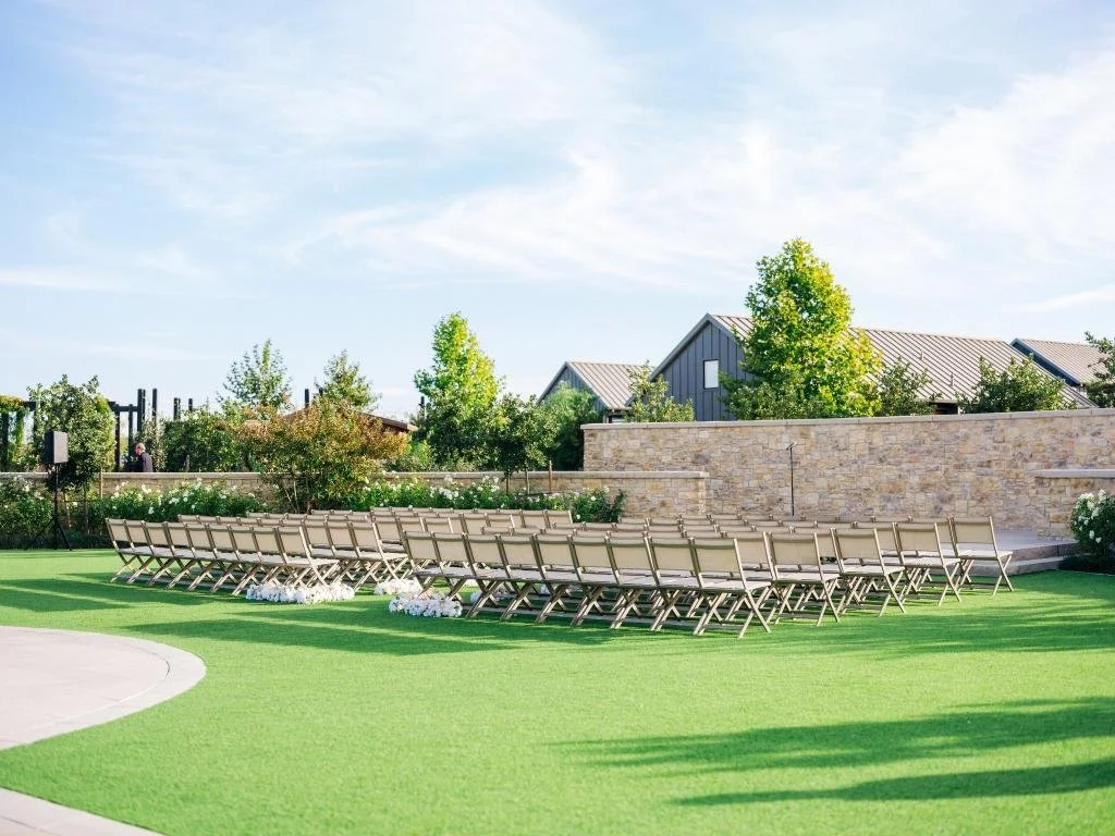 Guest chairs arranged for an outdoor wedding ceremony at Stanly Ranch