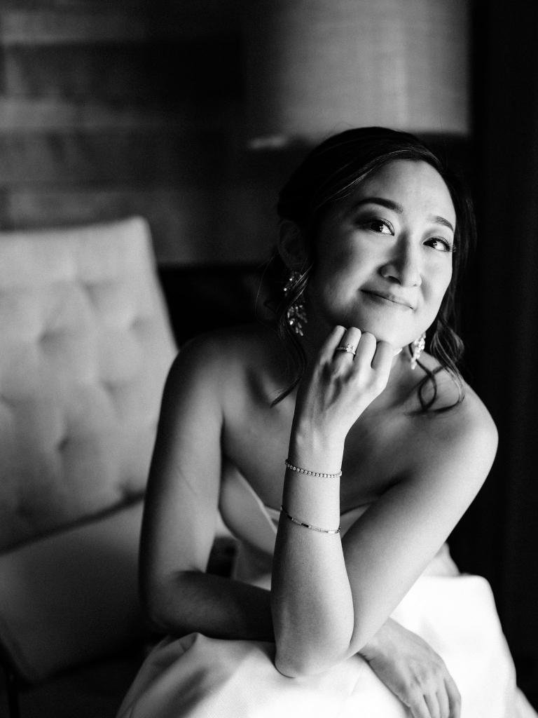 Bride smiling at the camera before her wedding ceremony