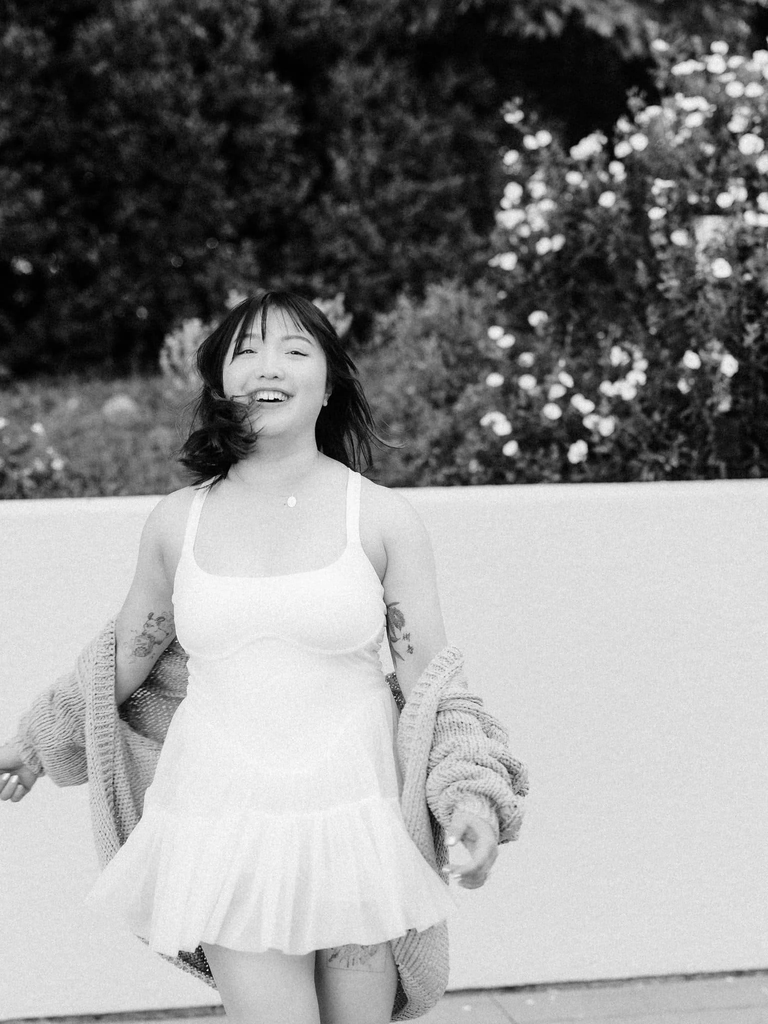 Bride-to-be smiling at the camera during her engagement session at Montalvo Arts Center in Saratoga.