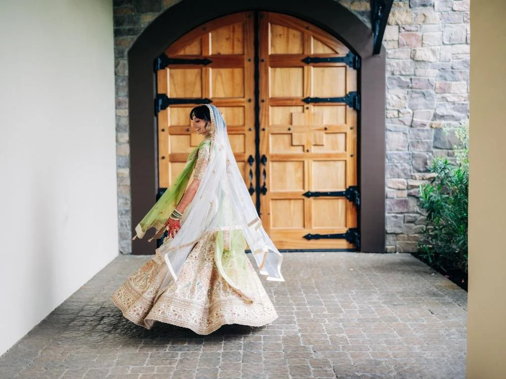 Bride twirling in her wedding dress during portraits