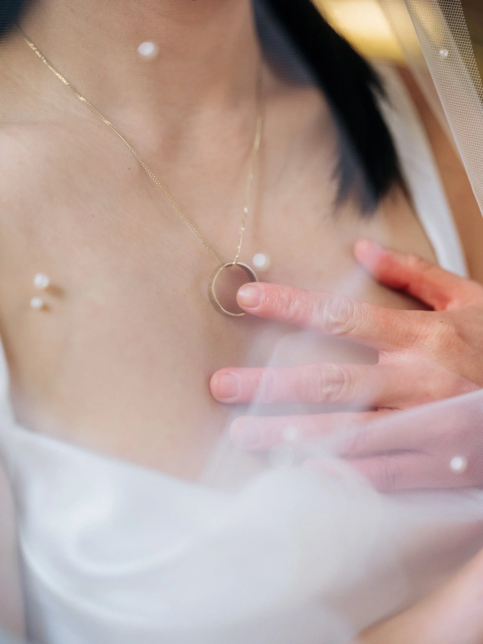 Close-up of bride’s necklace at San Francisco City Hall wedding