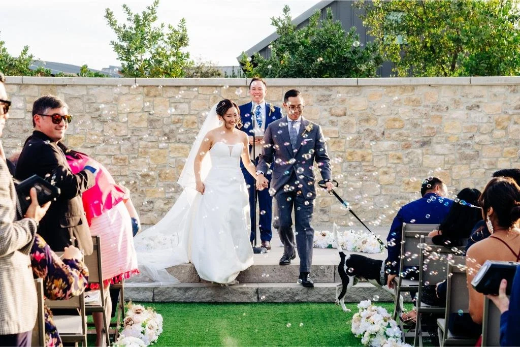 Newlyweds walking down the aisle together after their wedding ceremony