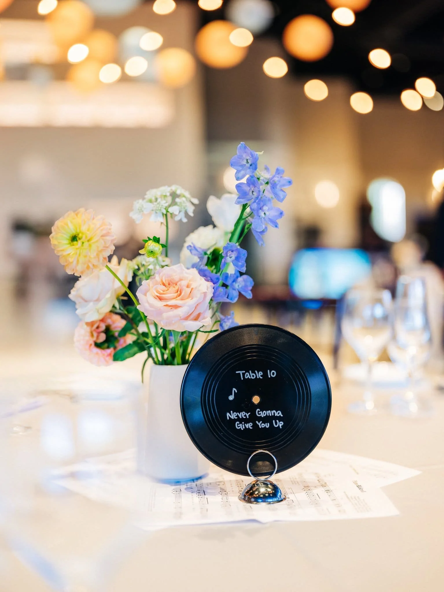 wedding table setting detail with table number on record cassette palm event center pleasanton reception