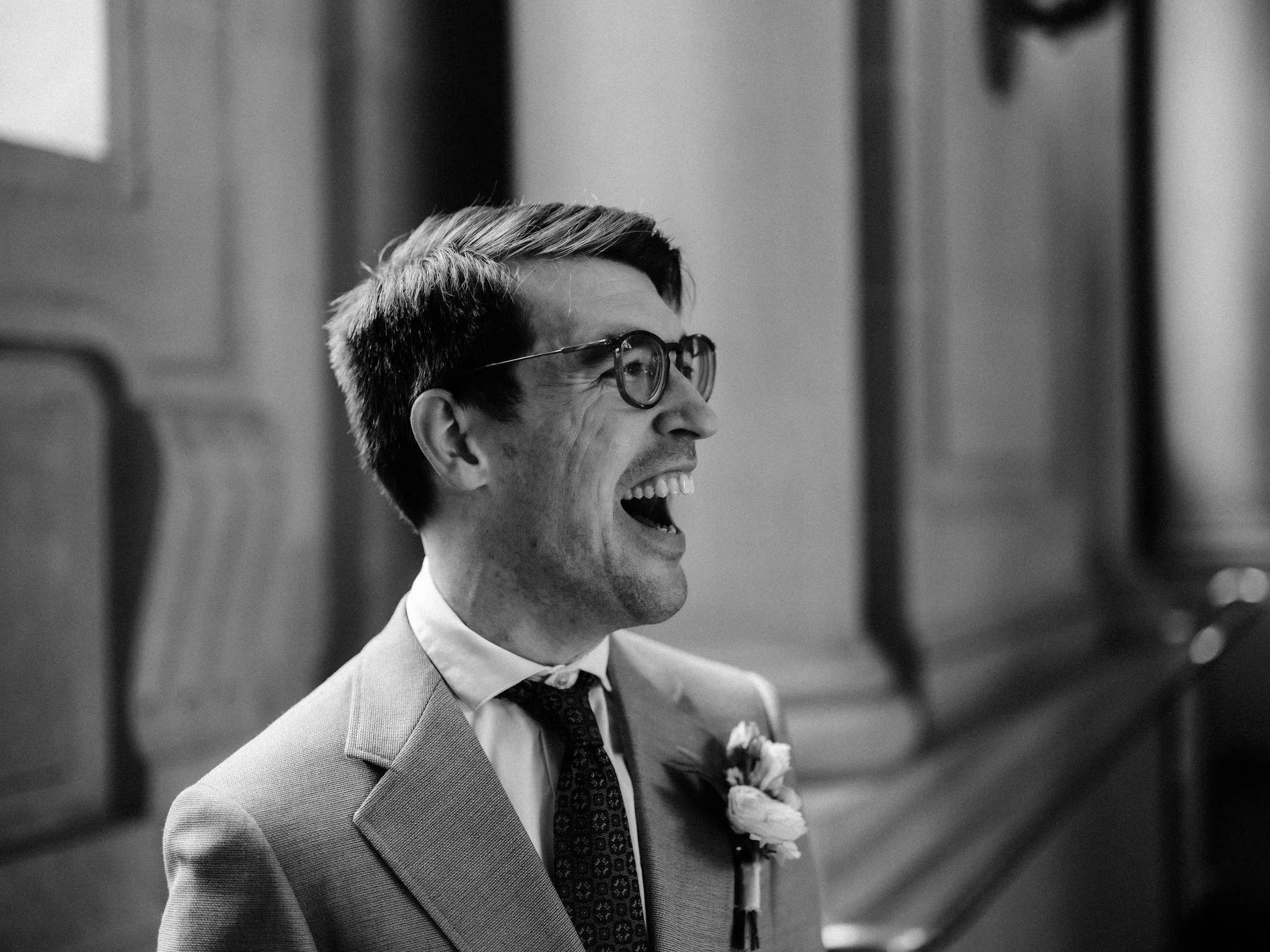 Groom smiling during San Francisco City Hall wedding portrait