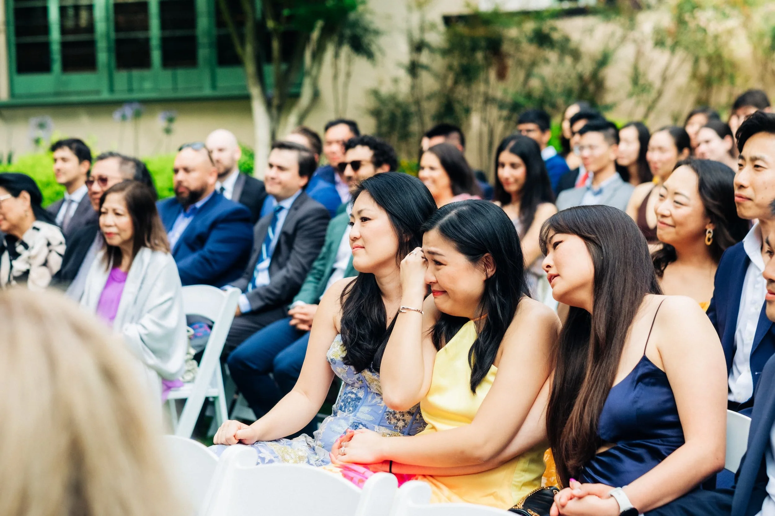 Emotional guests reacting during wedding ceremony at UC Berkeley