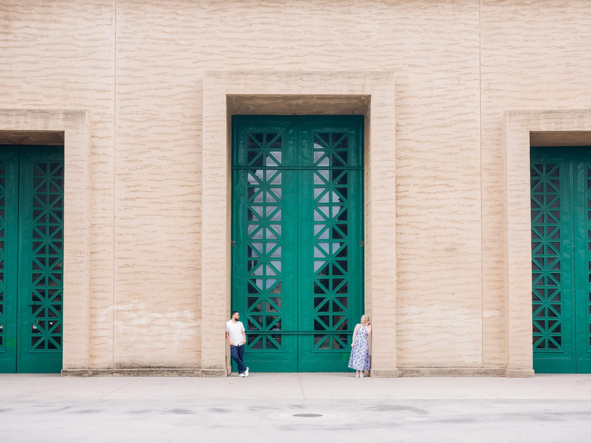 Couple posing in doorway at Palace of Fine Arts during engagement photos