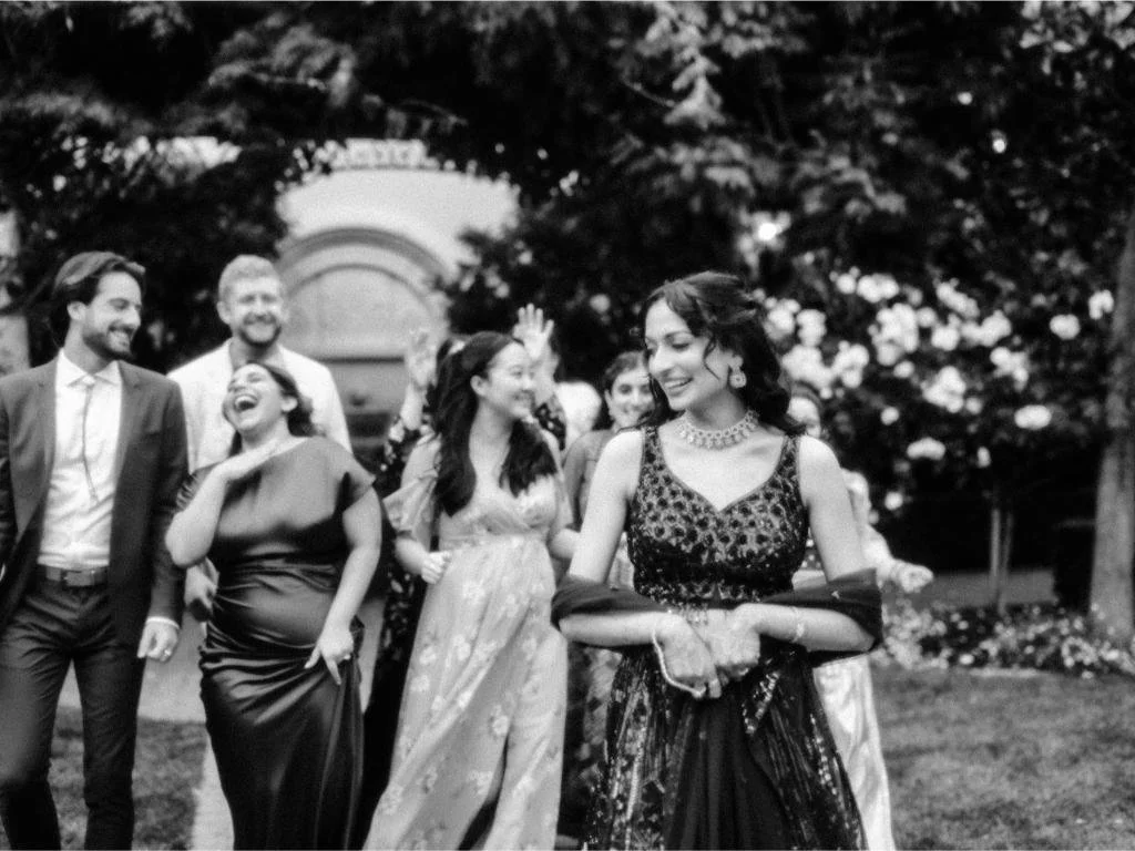 Bride walking ahead of wedding guests during the celebration