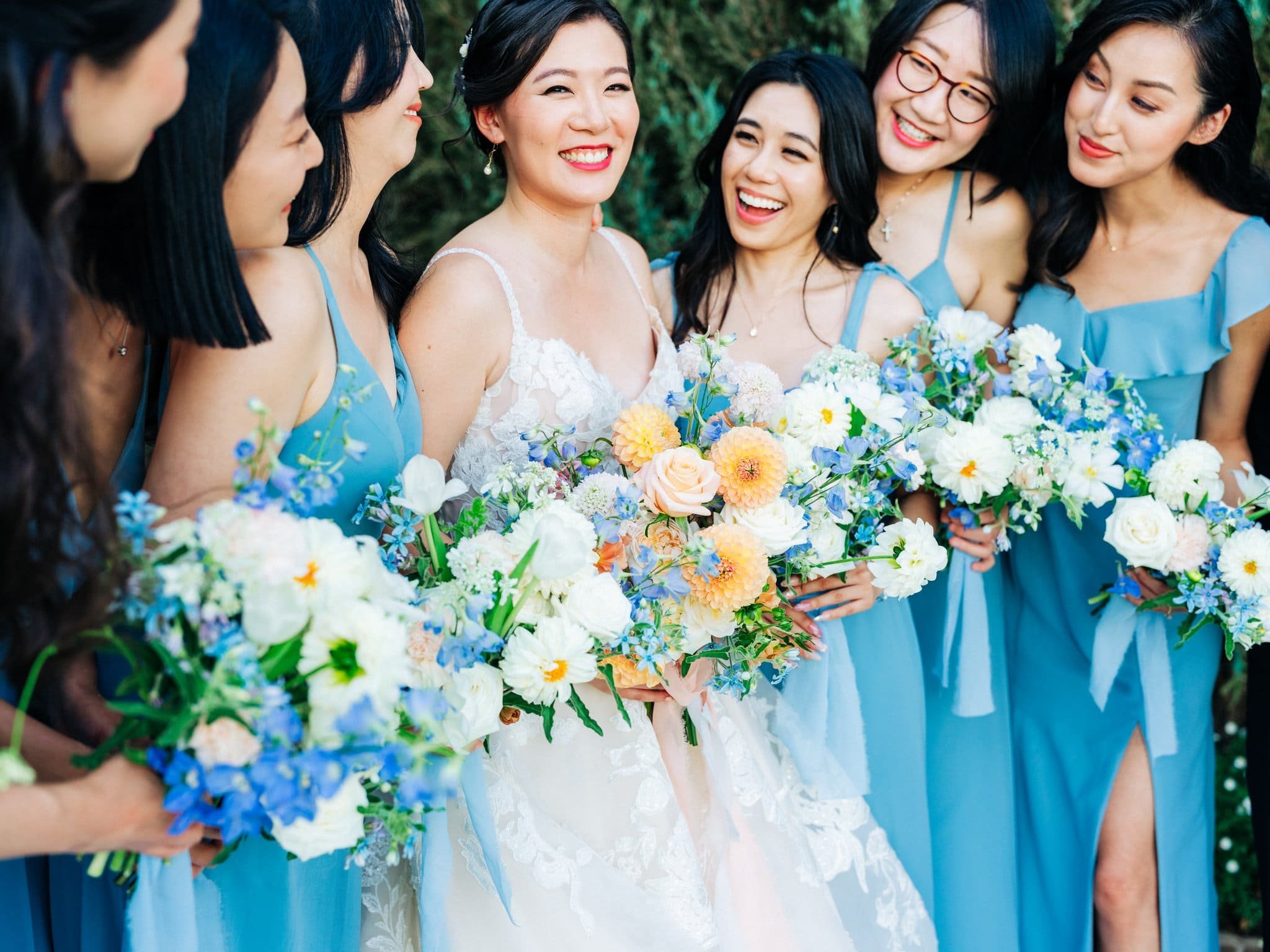 bride smiling with bridesmaids group portrait palm event center pleasanton wedding