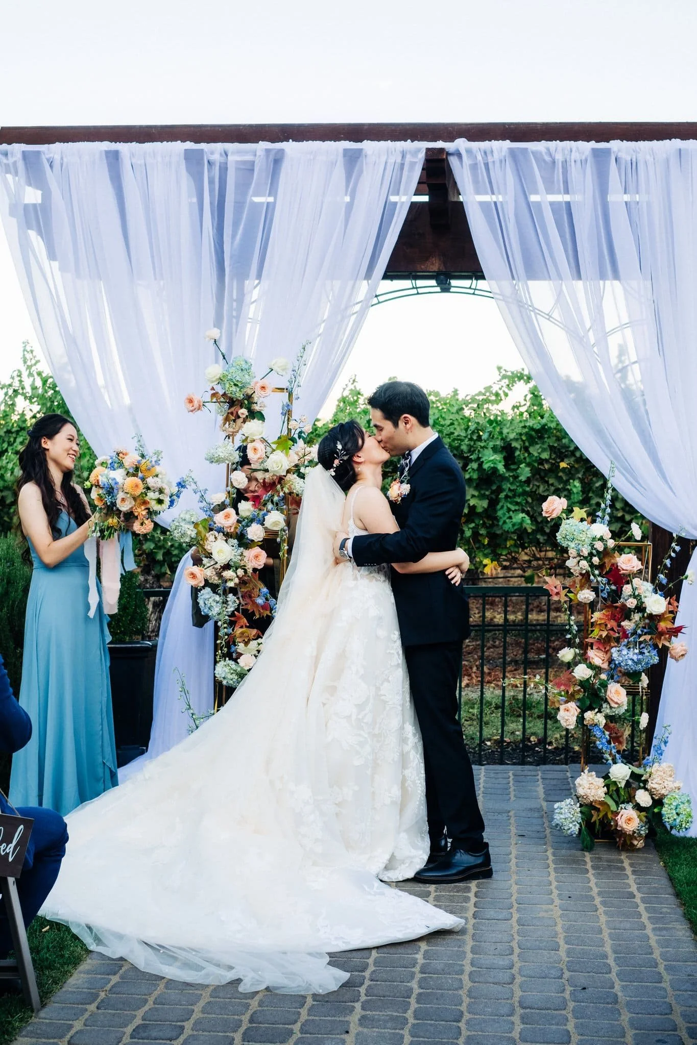 bride and groom first kiss at altar palm event center pleasanton wedding