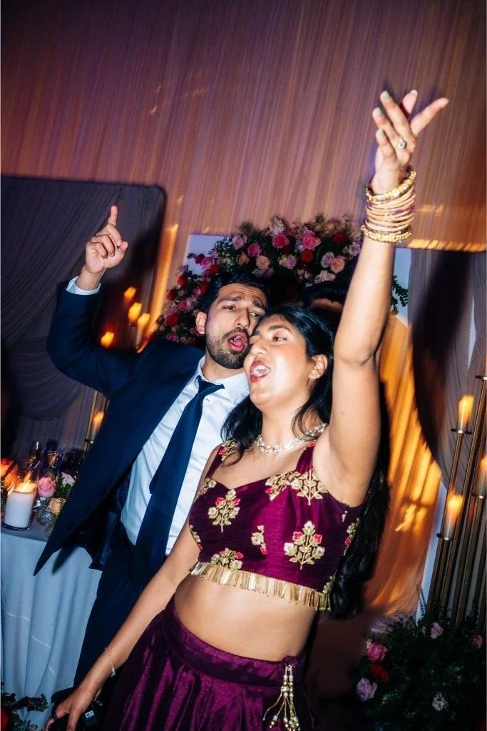 Two wedding guests dancing together on the reception dance floor