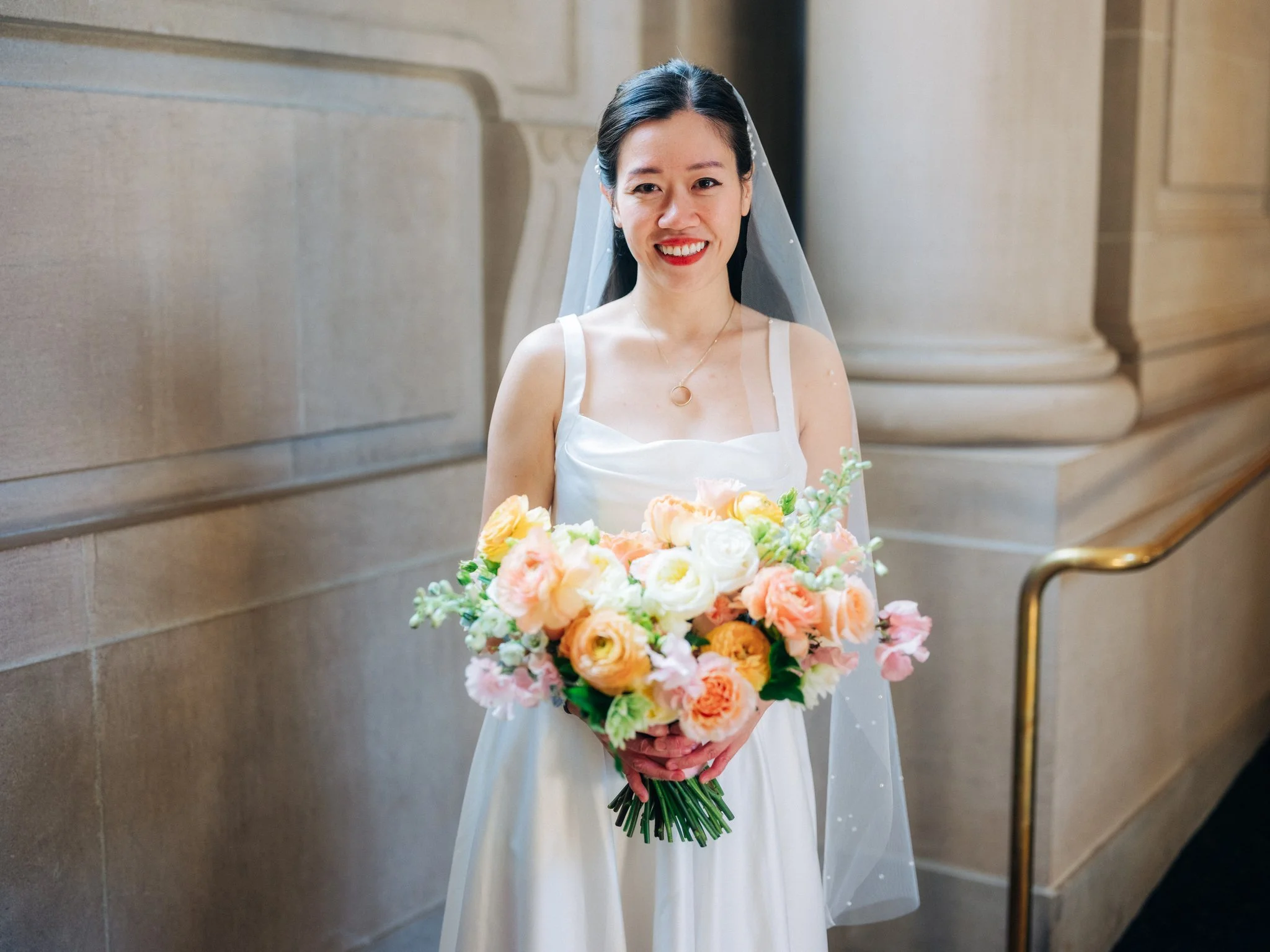 Bride posing in hallway at San Francisco City Hall wedding