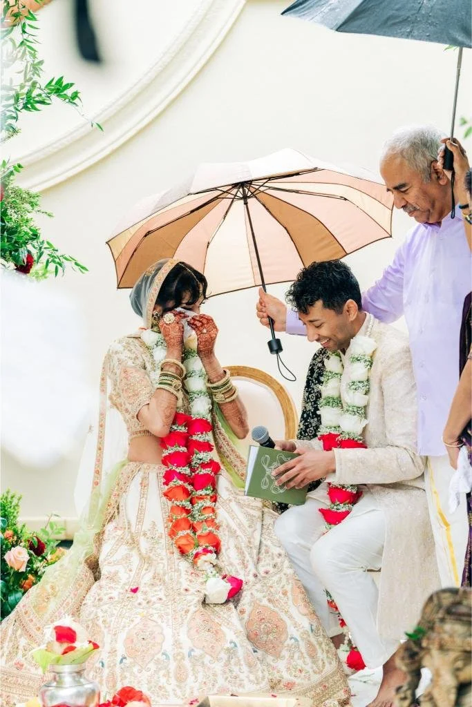 Bride becoming emotional as the groom reads his wedding vows