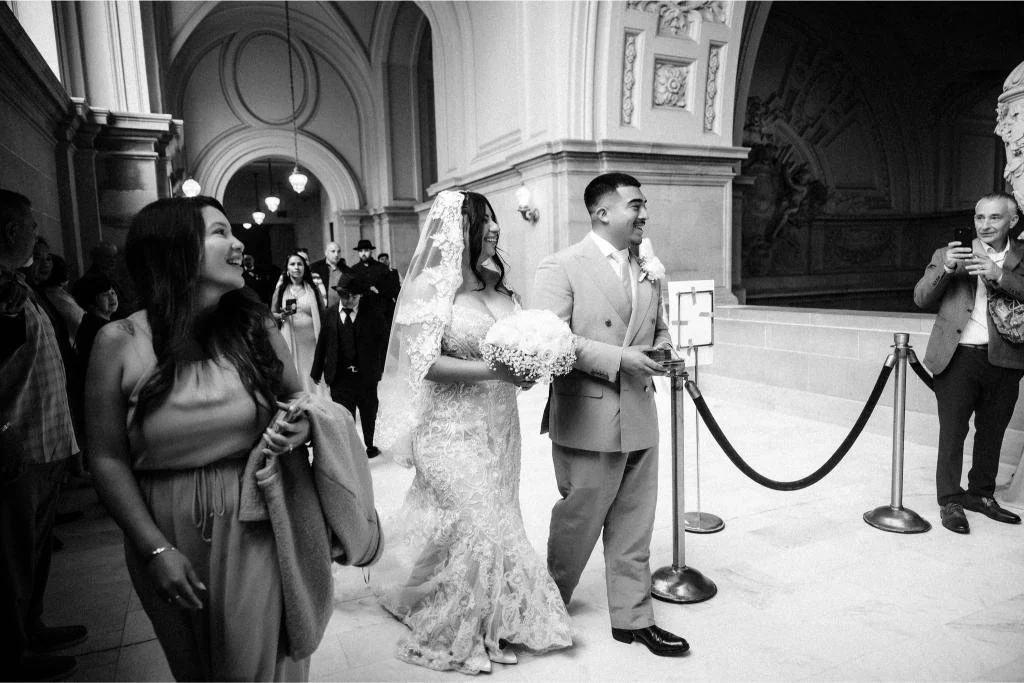 Bride and groom walking hand in hand toward the officiant.