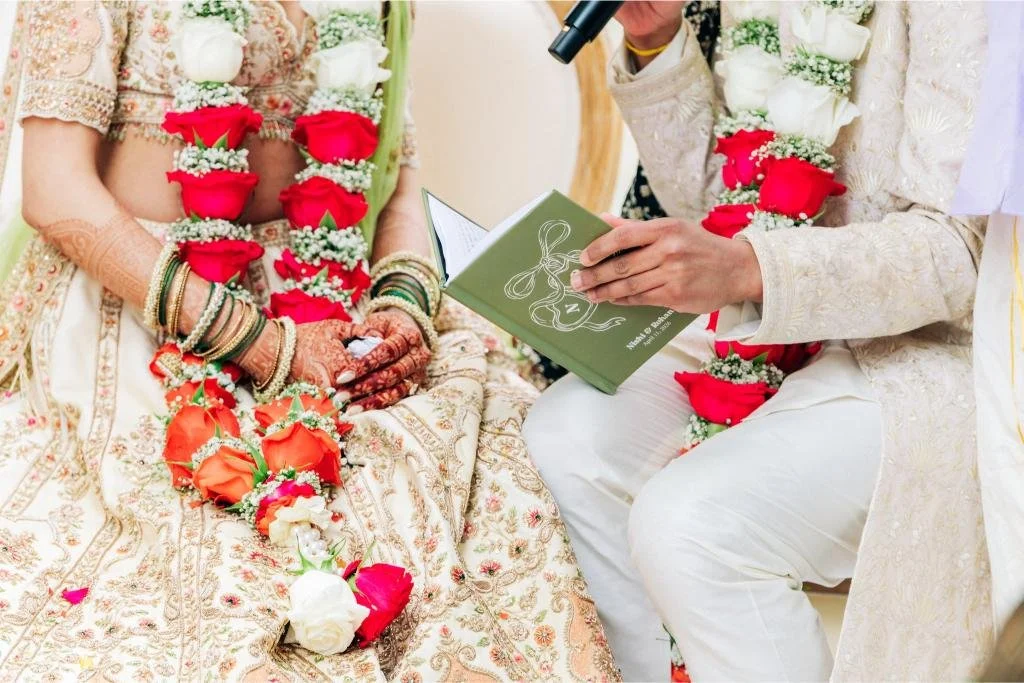 Close-up of the notebook the groom reads from while sharing his wedding vows