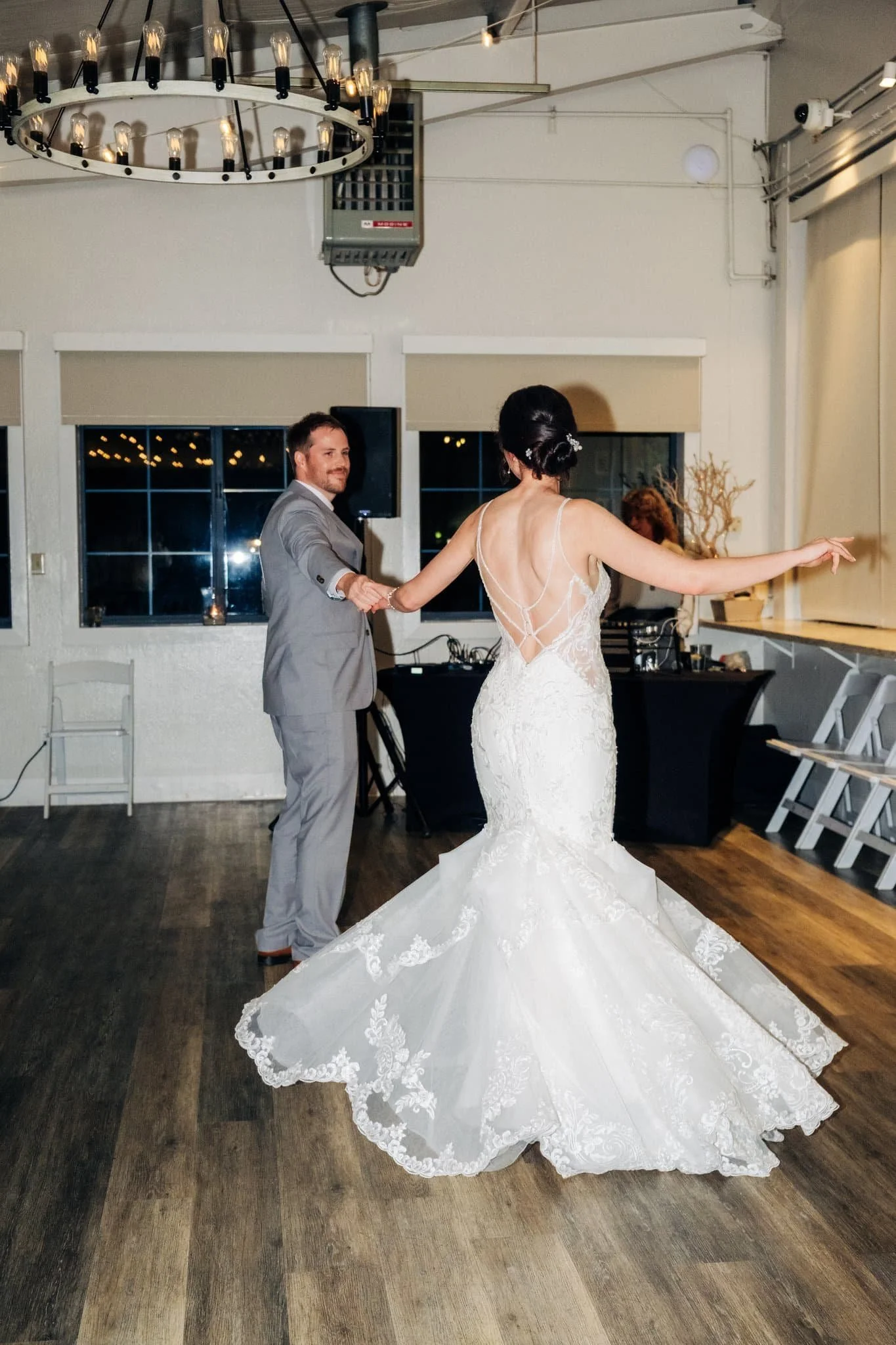 Bride and groom sharing their first dance at Maverick's Beach House during their Half Moon Bay wedding reception