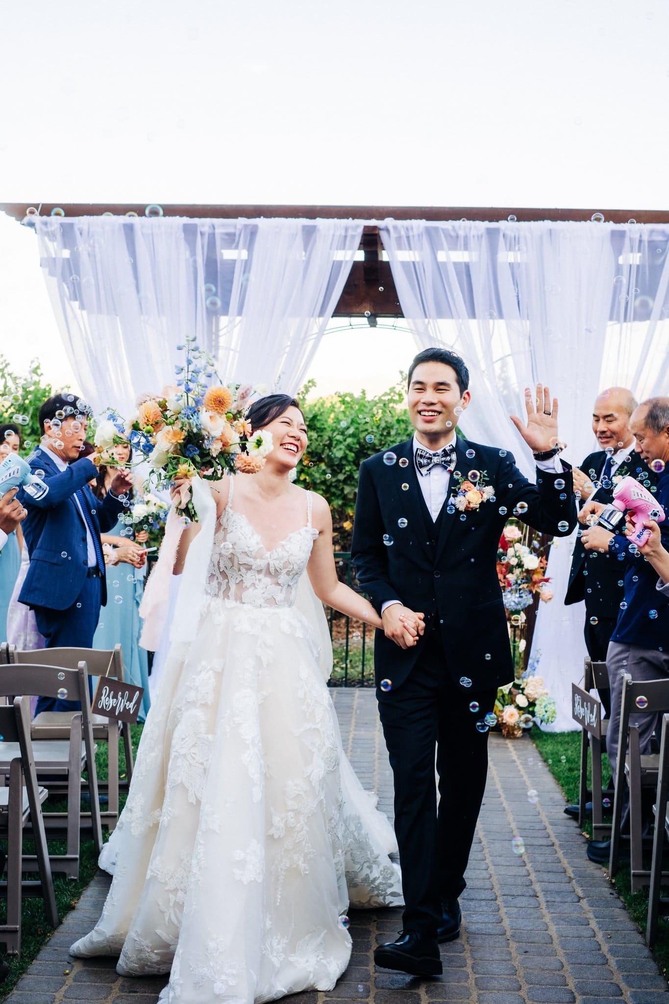 bride and groom walking up aisle after ceremony just married palm event center pleasanton wedding