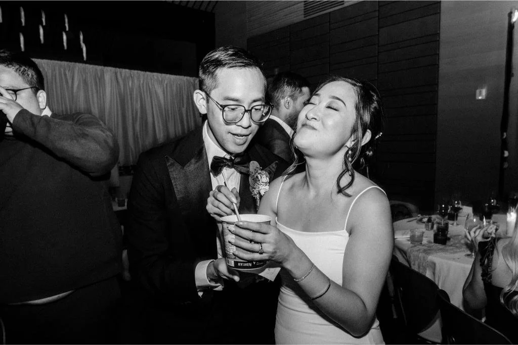 Bride enjoying Shin Ramyun on the dance floor late in the wedding reception