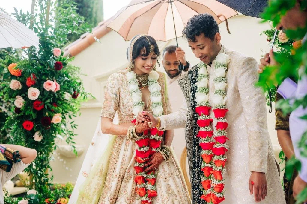 Bride and groom holding hands together during the wedding ceremony