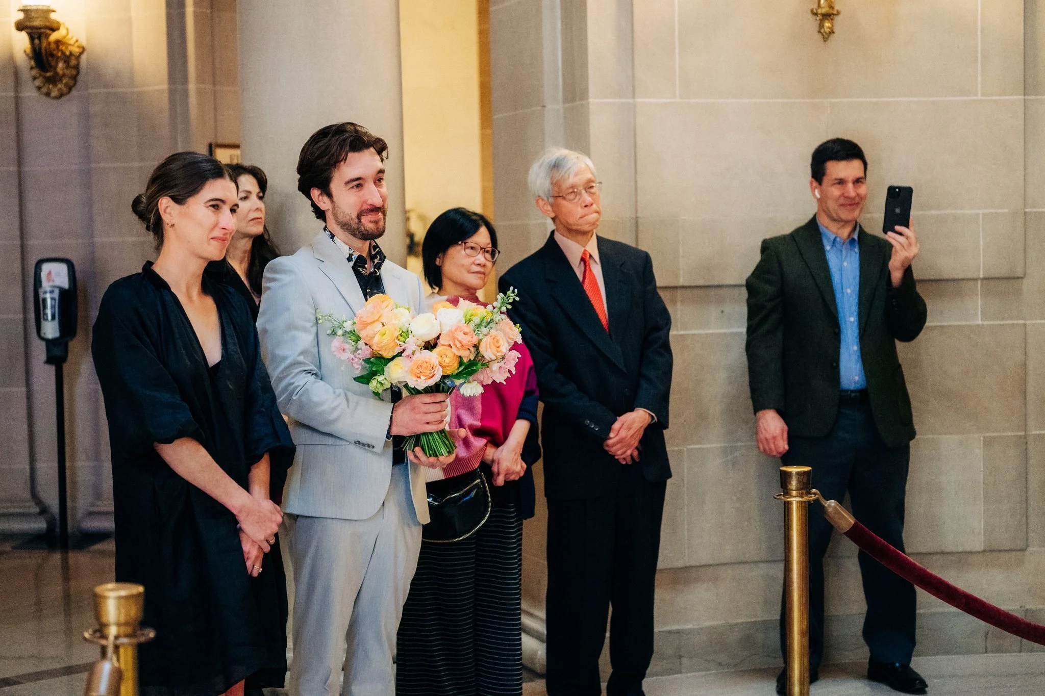 Guests watching wedding ceremony at San Francisco City Hall