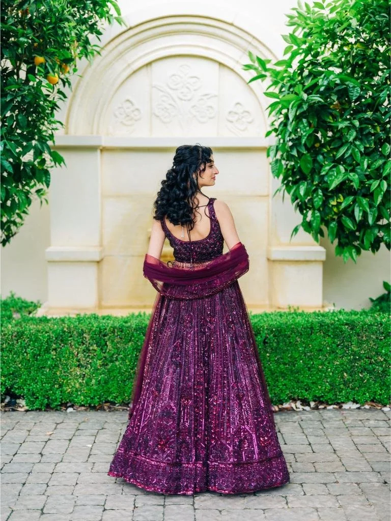 Back view of the bride’s wedding attire showing its detailed design