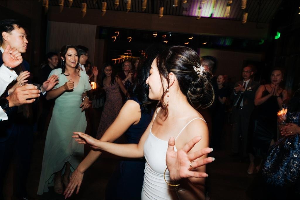 Bride dancing with guests during the wedding reception