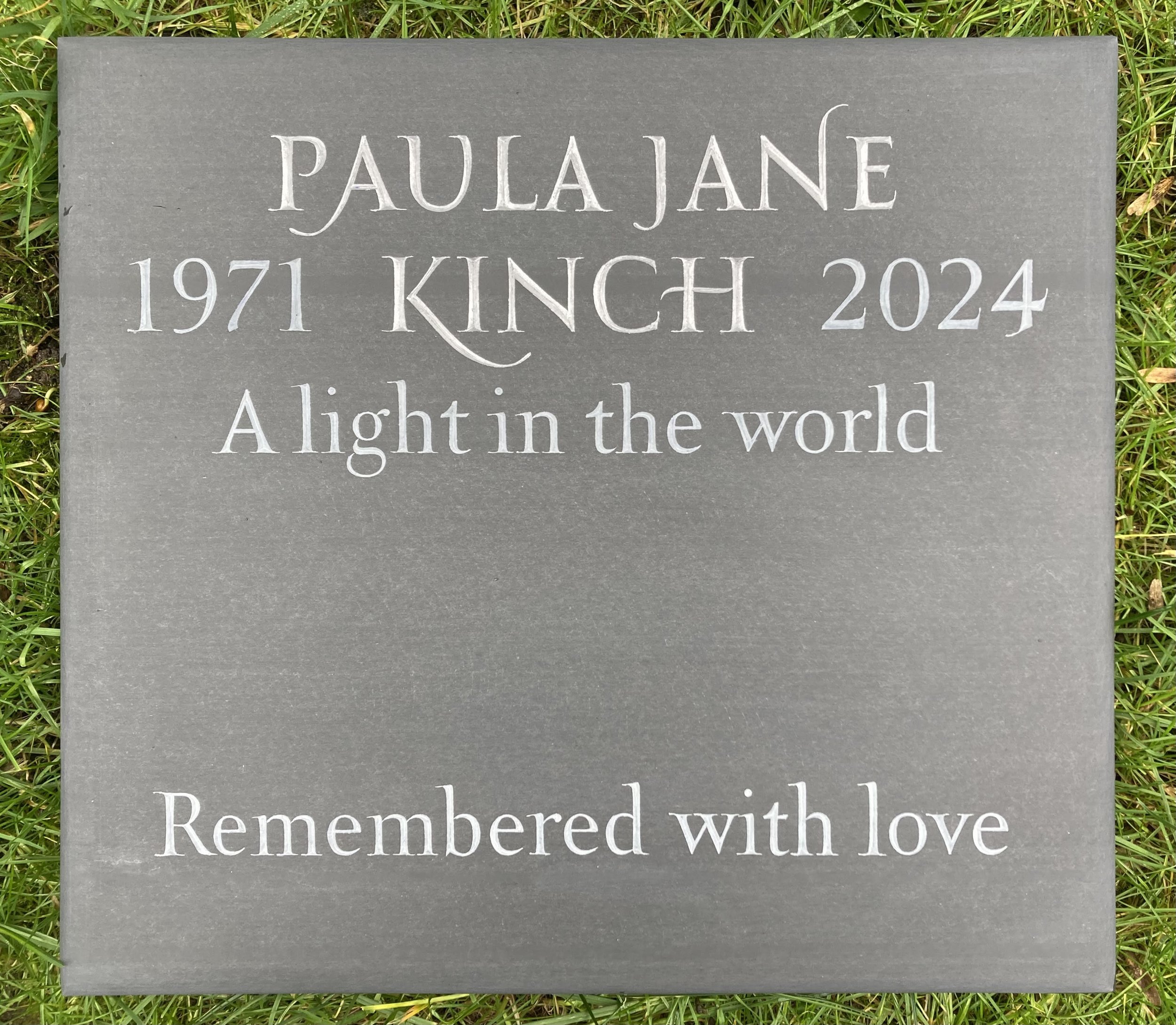 Cremation tablet in cumbrian black slate with space left for an additional inscription at a later date