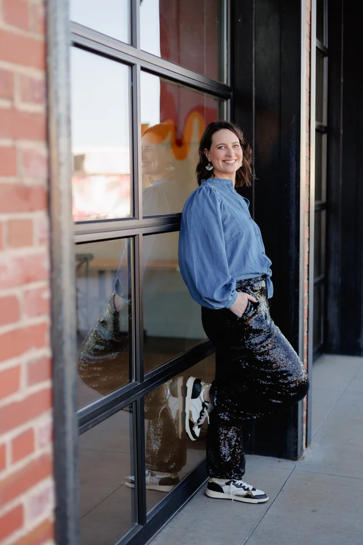 Suzanne Patel standing beside a window