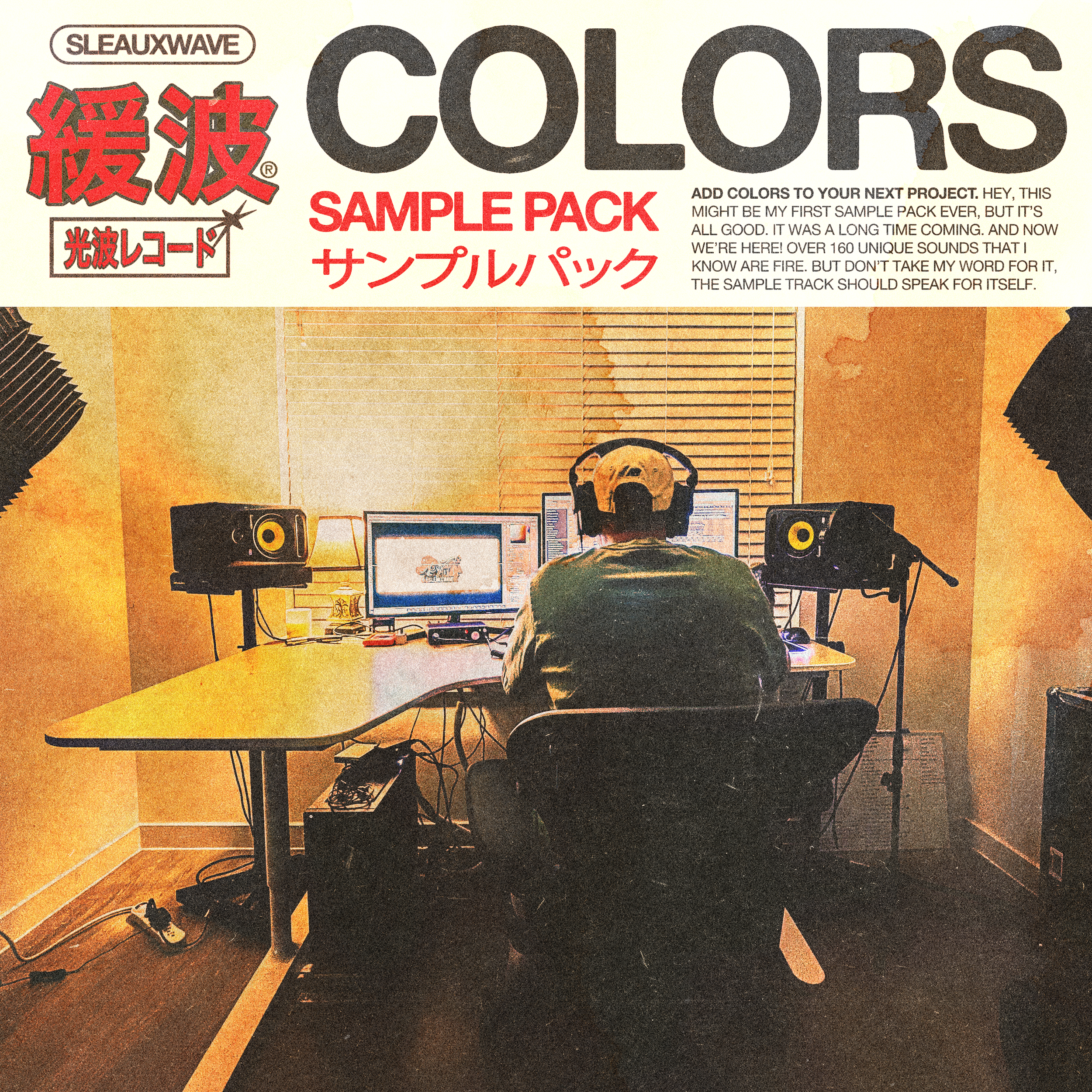 Person working at home studio with two computer monitors, headphones, and studio speakers in a dimly lit room.