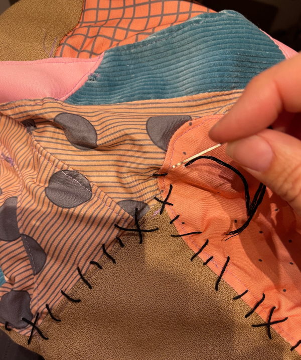After I sewed the dress pieces together, I added faux stitching with embroidery thread for a more stop-motion puppet look