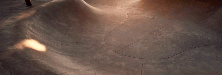 Skateboarder riding a concrete bowl in Venice Beach, California, captured as a cinematic lifestyle moment for commercial photo and video production.