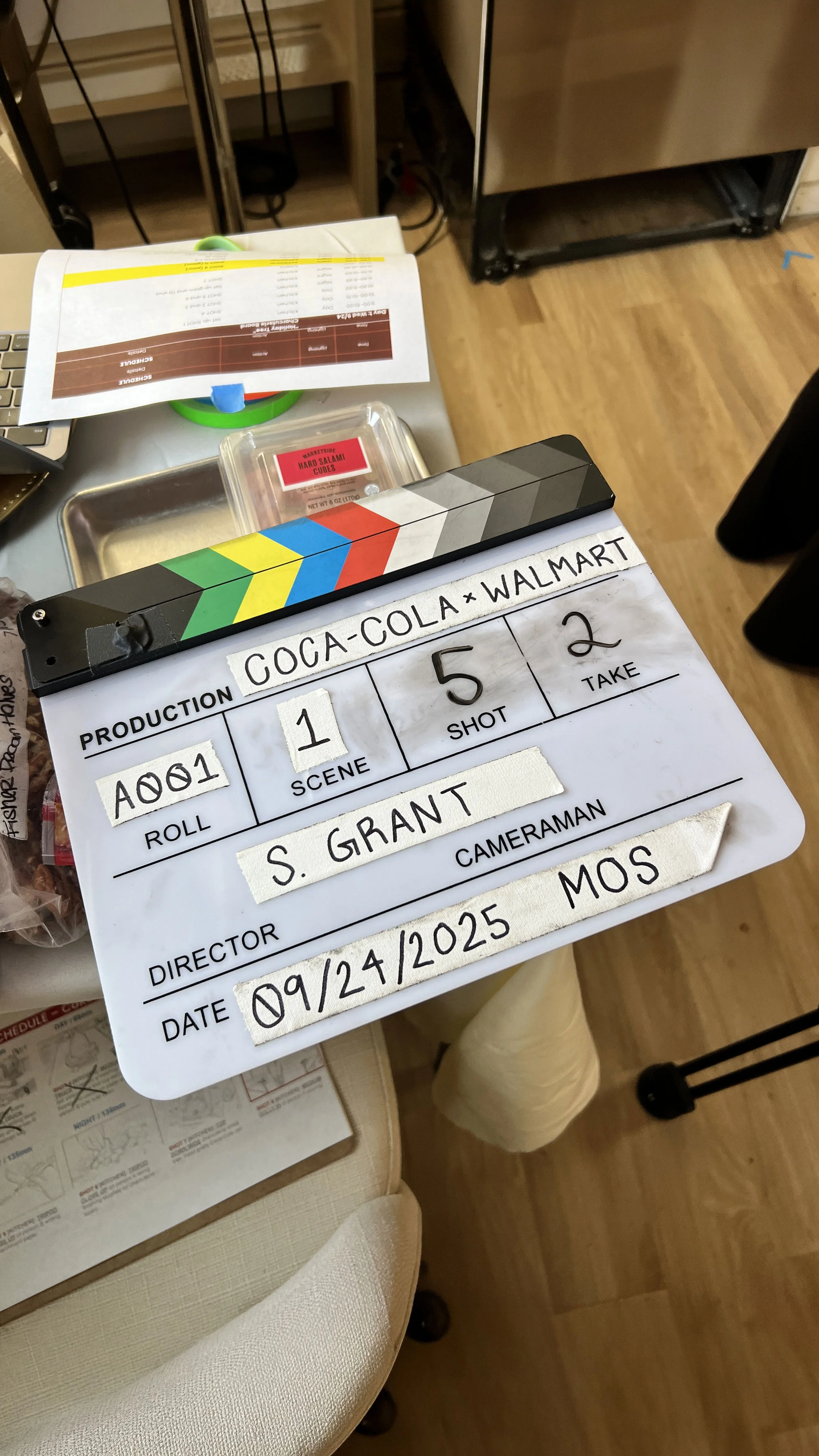 Production clapperboard from a commercial shoot for Coca-Cola and Walmart, directed by Sam Grant Productions, representing large-scale brand collaboration, on-set production workflow, and commercial video execution.