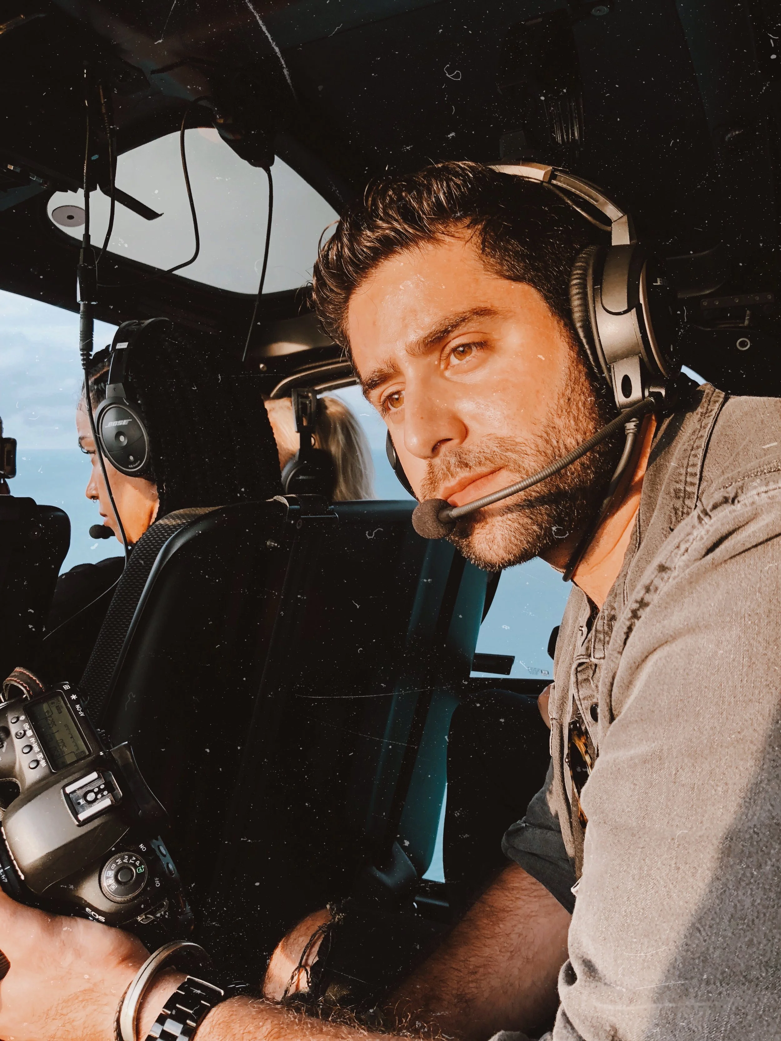 Portrait of Sam Grant, Los Angeles-based commercial photographer and director, captured in a candid behind-the-scenes moment on set.