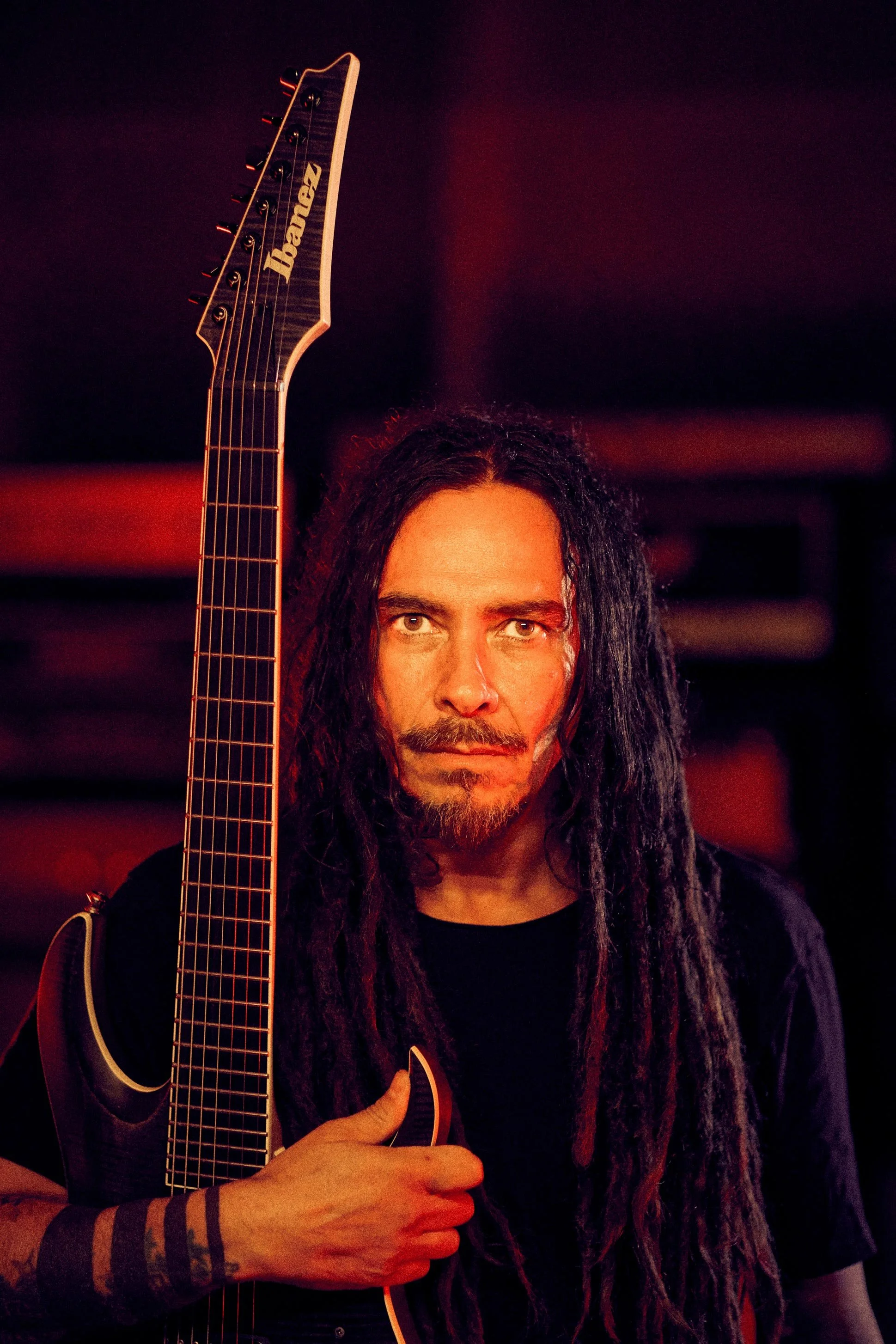 Munky from Korn holding his Ibanez signature guitar during the Distortion Inc. pedal launch shoot.