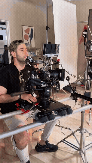 Camera operator working a motion-control rig during the Coca-Cola Walmart studio production